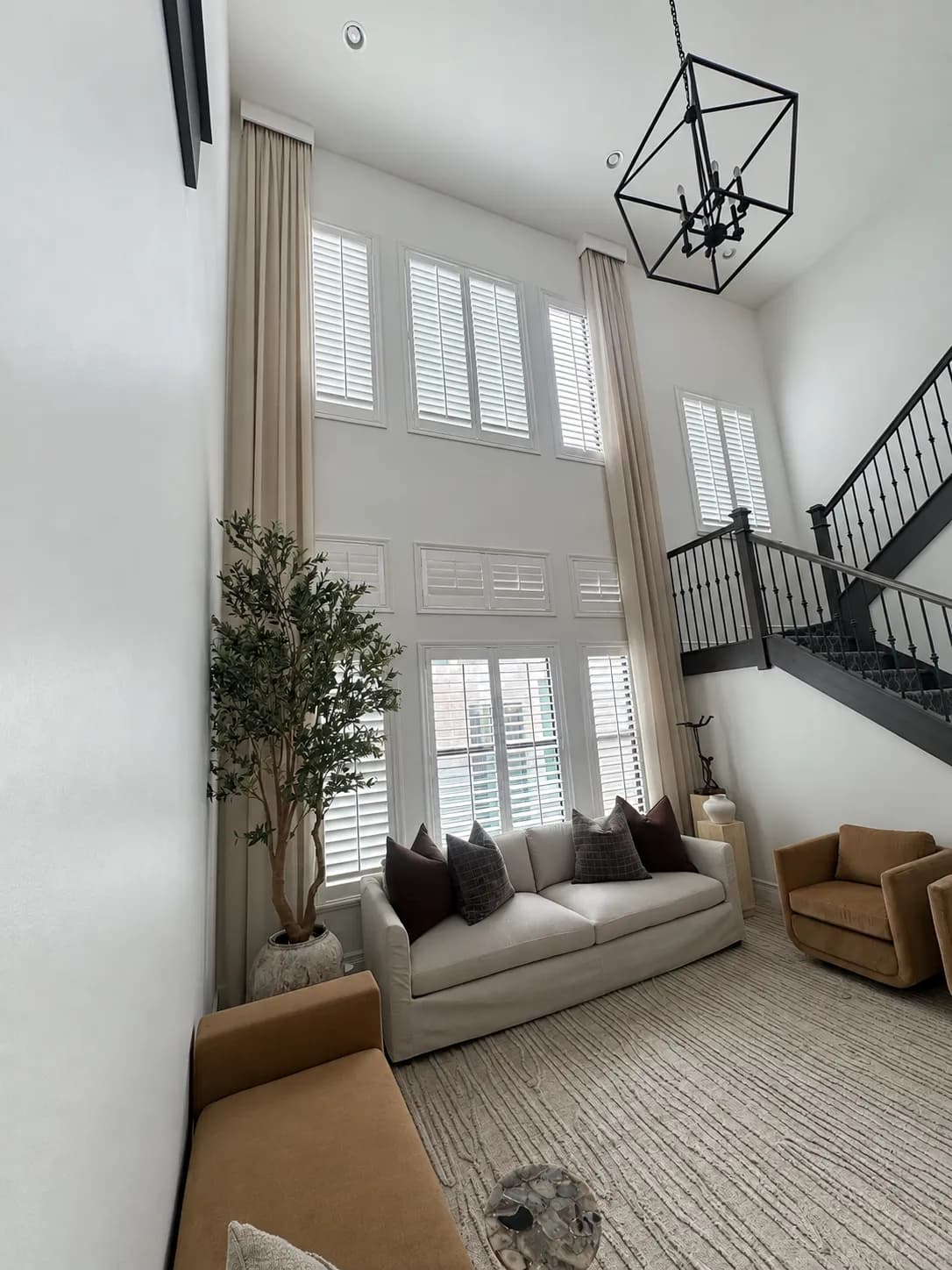 double-height-living-room-plantation-shutters-staircase-enhanced