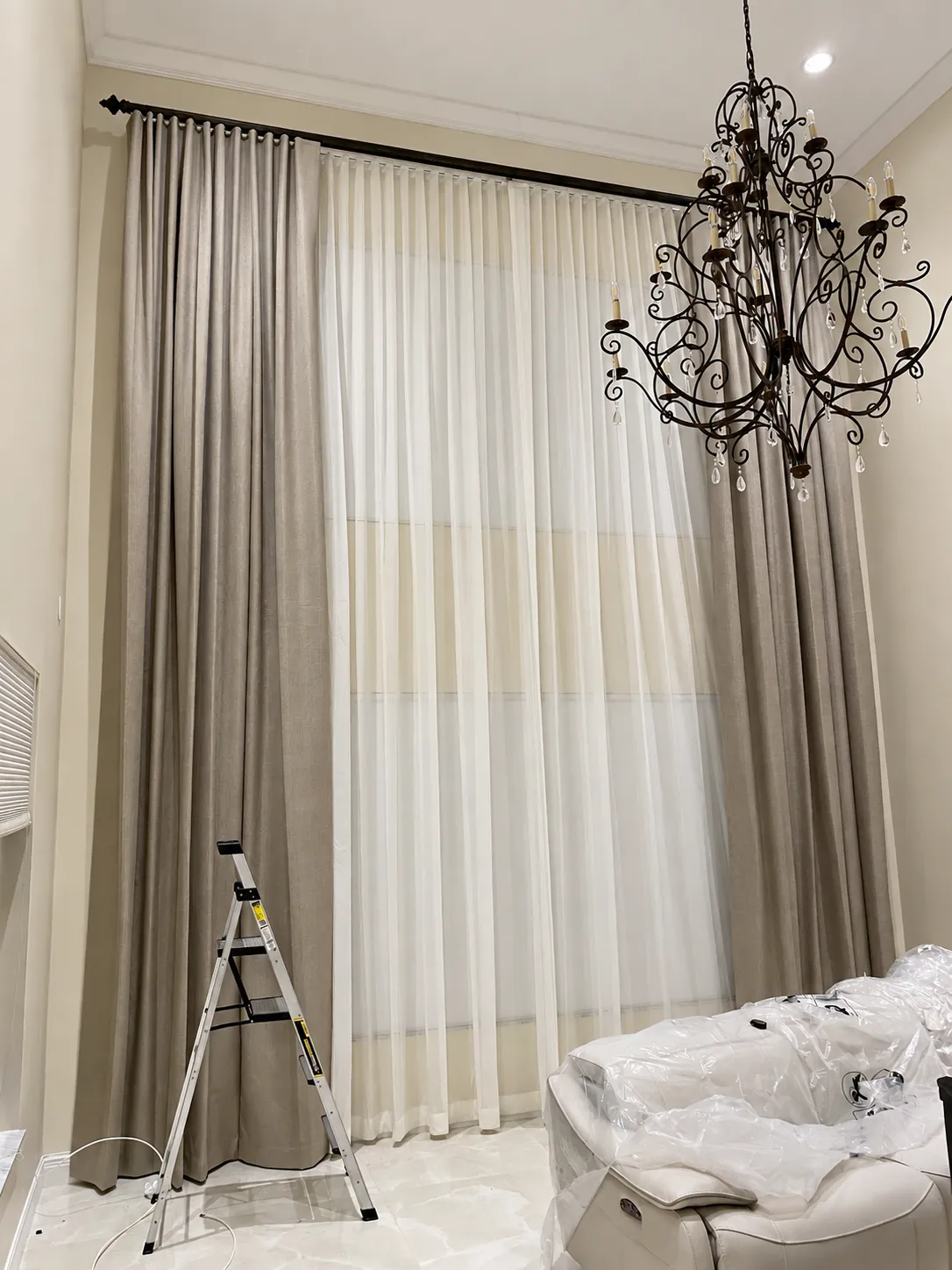 tall-window-linen-drapery-chandelier-installation-enhanced